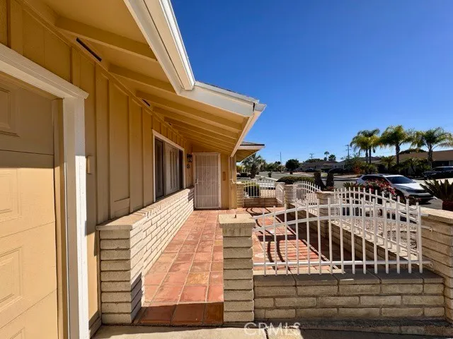 a view of a balcony with chairs