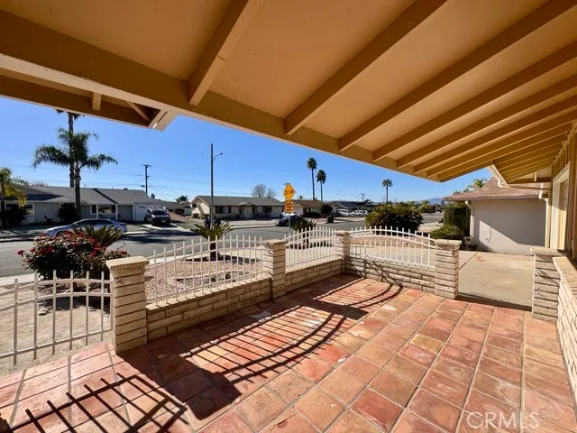 a view of a patio with table and chairs with wooden floor