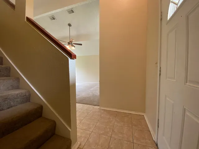 a view of entryway and kitchen