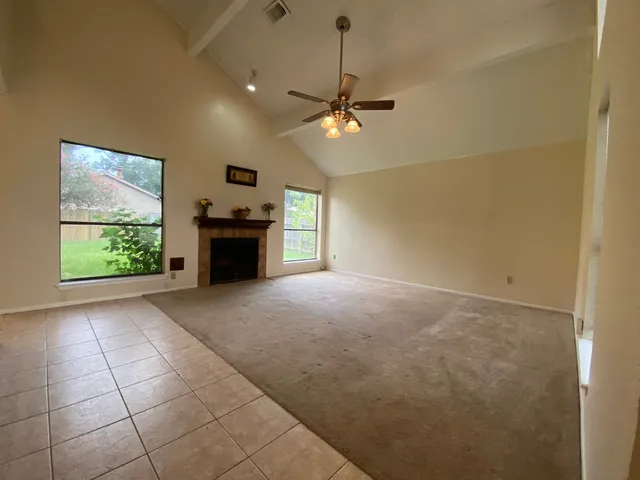 a view of a livingroom with a kitchen