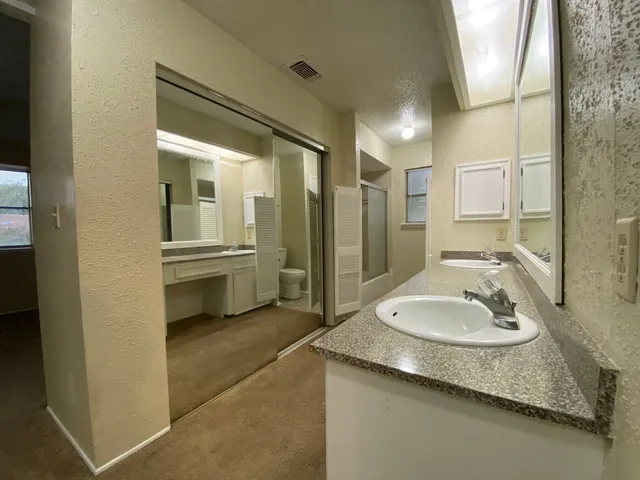 a bathroom with a toilet and shower