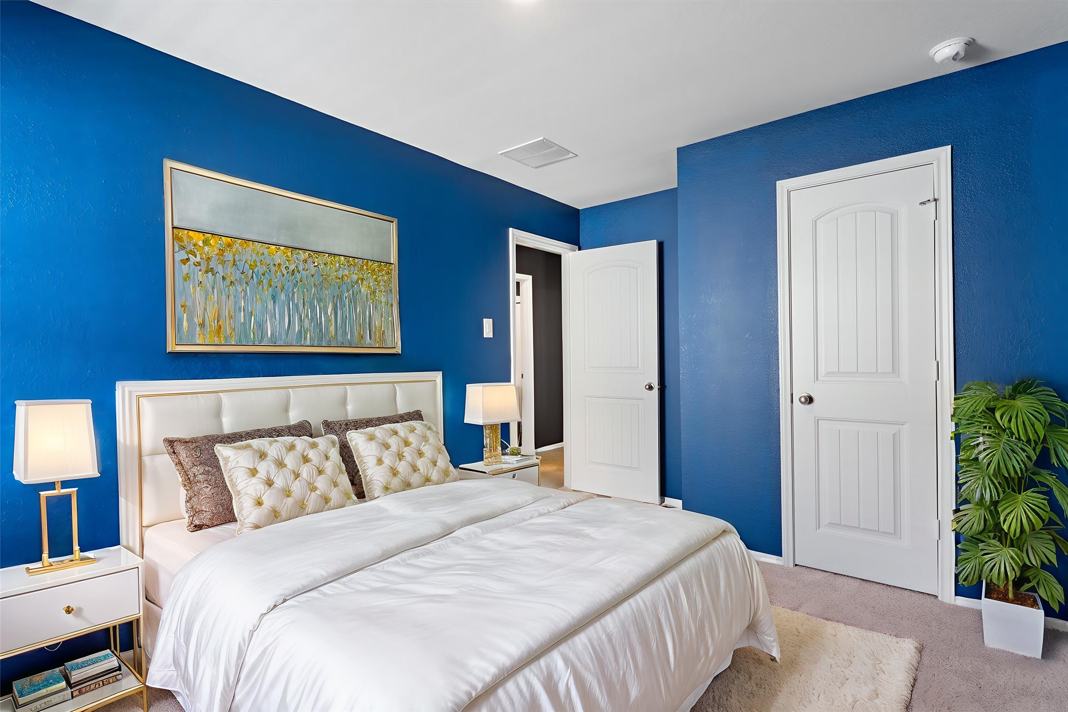 352 Sickle Loop Uhland, TX 78640 - Photo 25 of 36 a bedroom with a bed and a painting on the wall