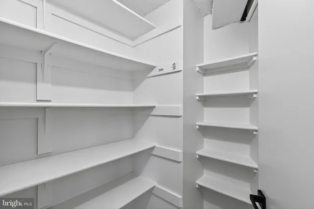 a view of a porch with furniture and a yard