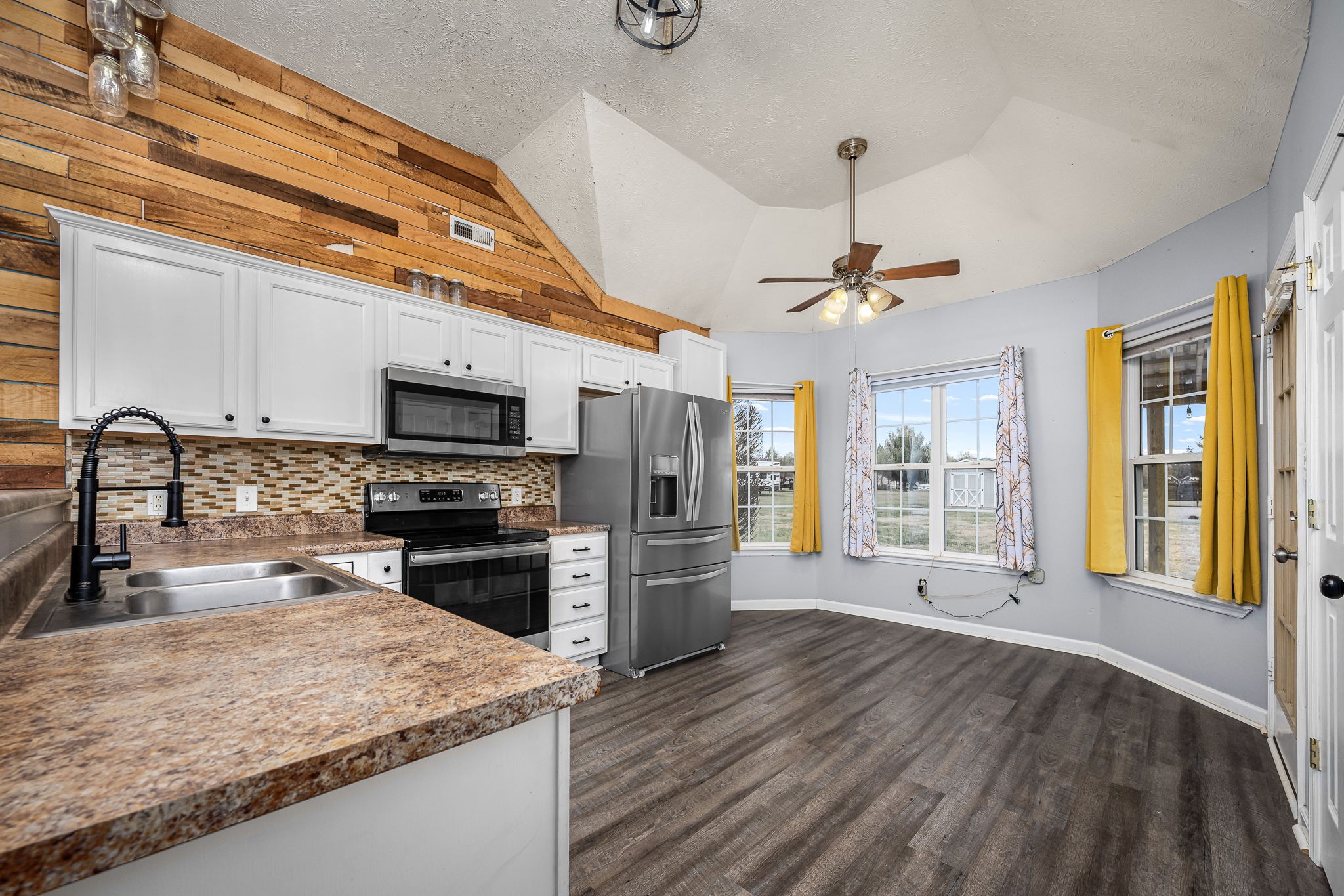 8100 Cedar Forest Road Lascassas, TN 37085 - Photo 12 of 52 a kitchen with a refrigerator a sink and a stove