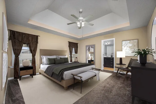 a bathroom with a granite countertop double vanity sink and a mirror