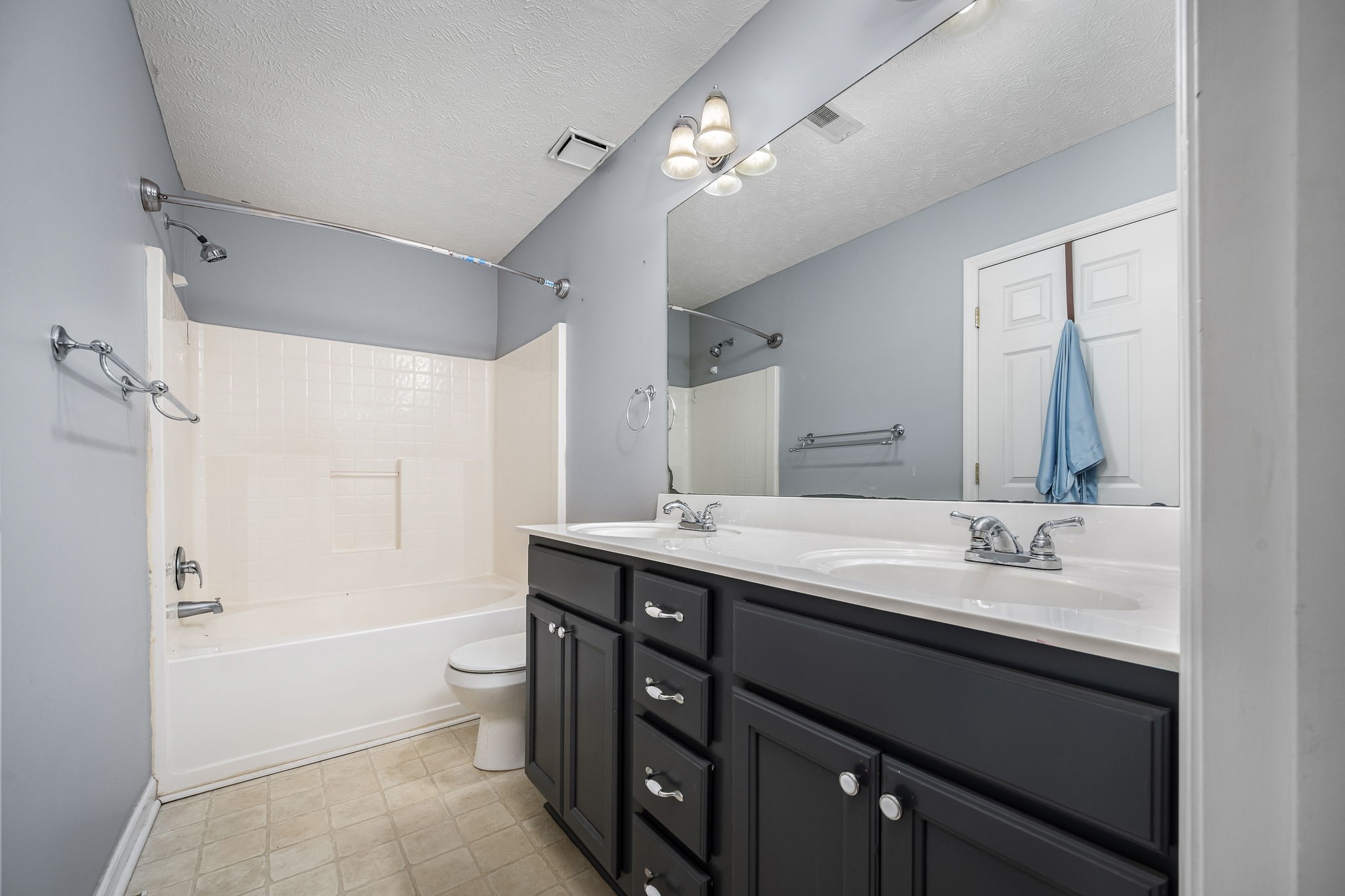 8100 Cedar Forest Road Lascassas, TN 37085 - Photo 22 of 52 a spacious bathroom with a double vanity sink toilet mirror and bathtub