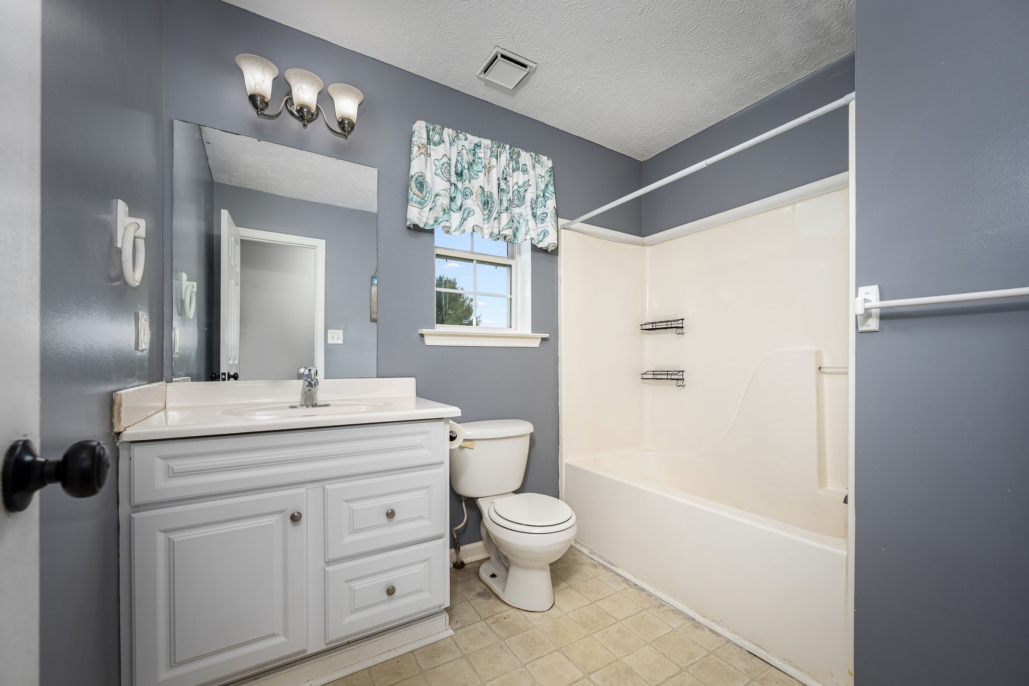8100 Cedar Forest Road Lascassas, TN 37085 - Photo 25 of 52 a bathroom with a granite countertop sink a toilet a mirror a vanity and shower