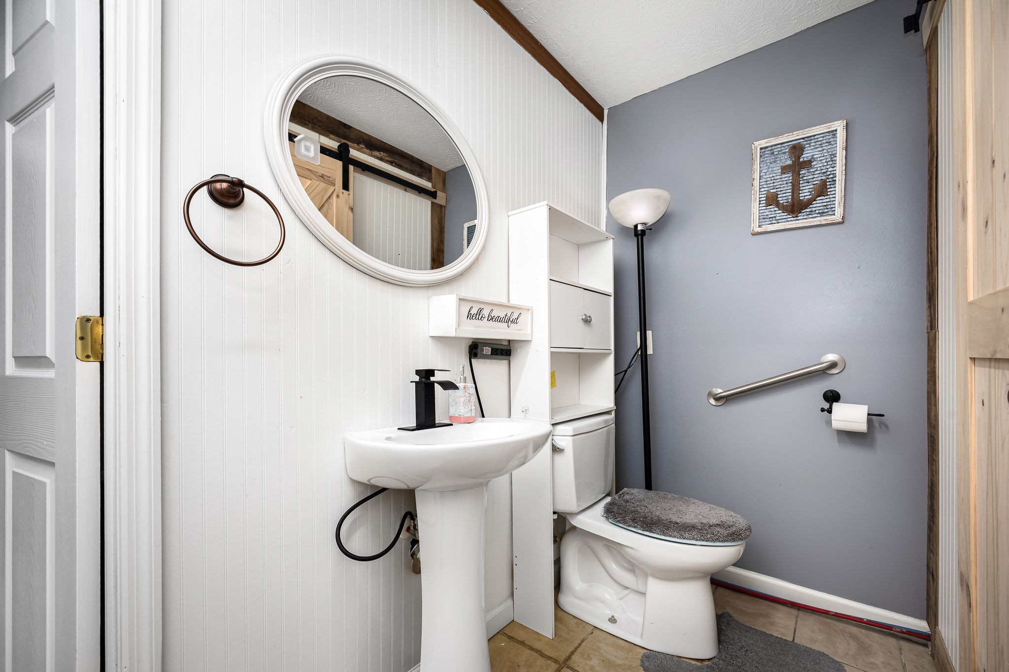 8100 Cedar Forest Road Lascassas, TN 37085 - Photo 29 of 52 a bathroom with a toilet sink and mirror