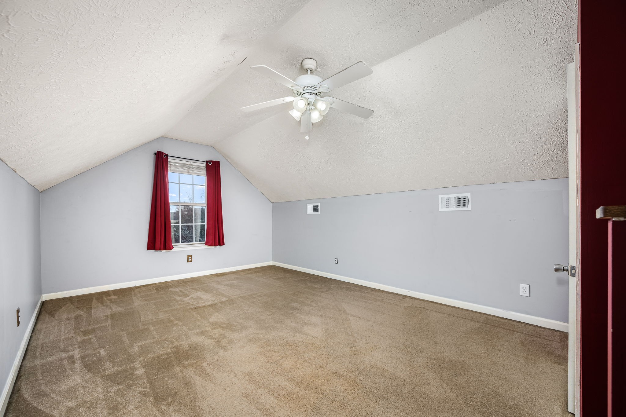 8100 Cedar Forest Road Lascassas, TN 37085 - Photo 33 of 52 an empty room with chandelier fan and windows