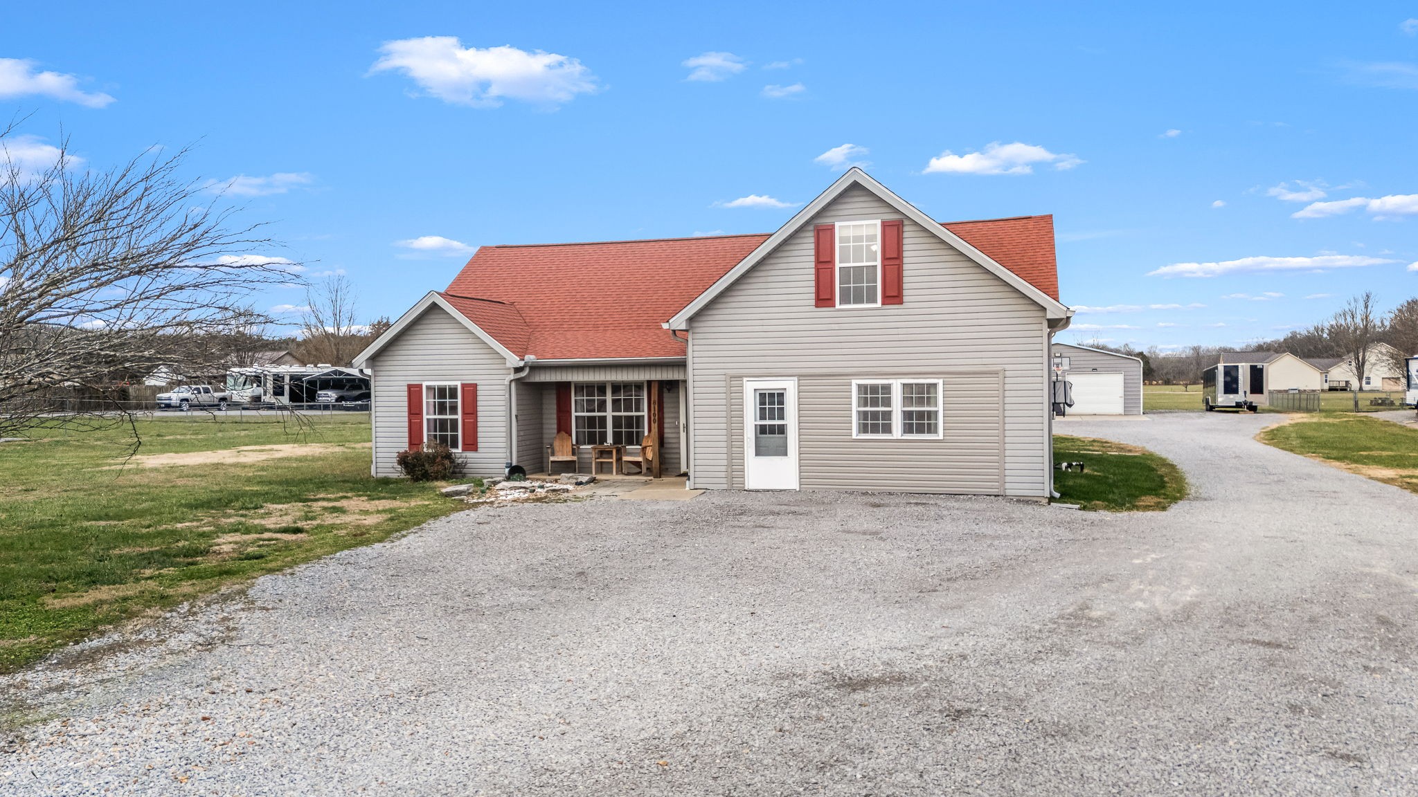 8100 Cedar Forest Road Lascassas, TN 37085 - Photo 4 of 52 a front view of a house with a yard and garage
