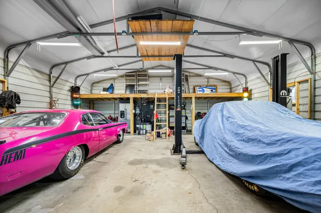 a front view of a house with a garden and yard