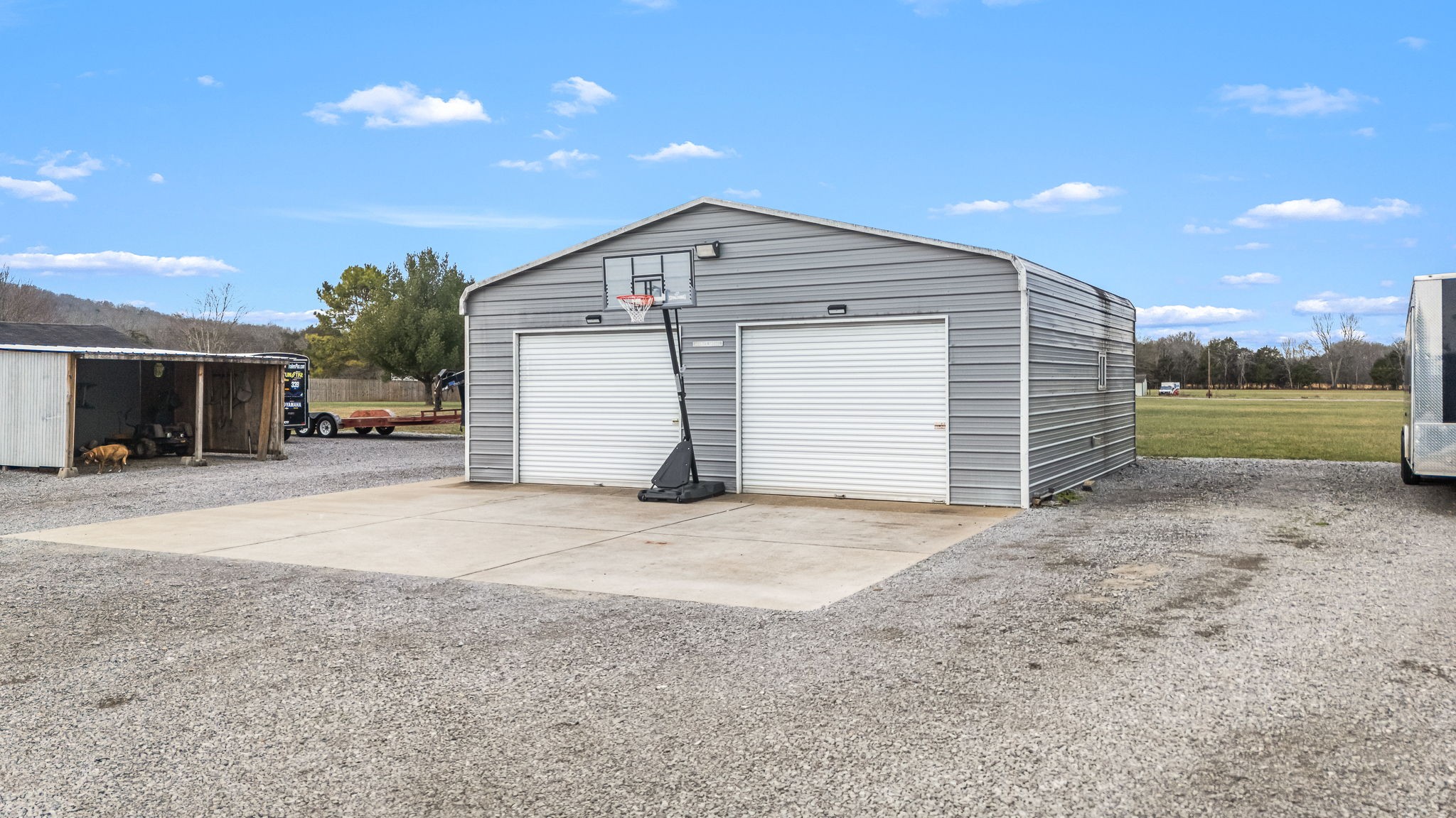 8100 Cedar Forest Road Lascassas, TN 37085 - Photo 44 of 52 a view of a house with a yard and garage