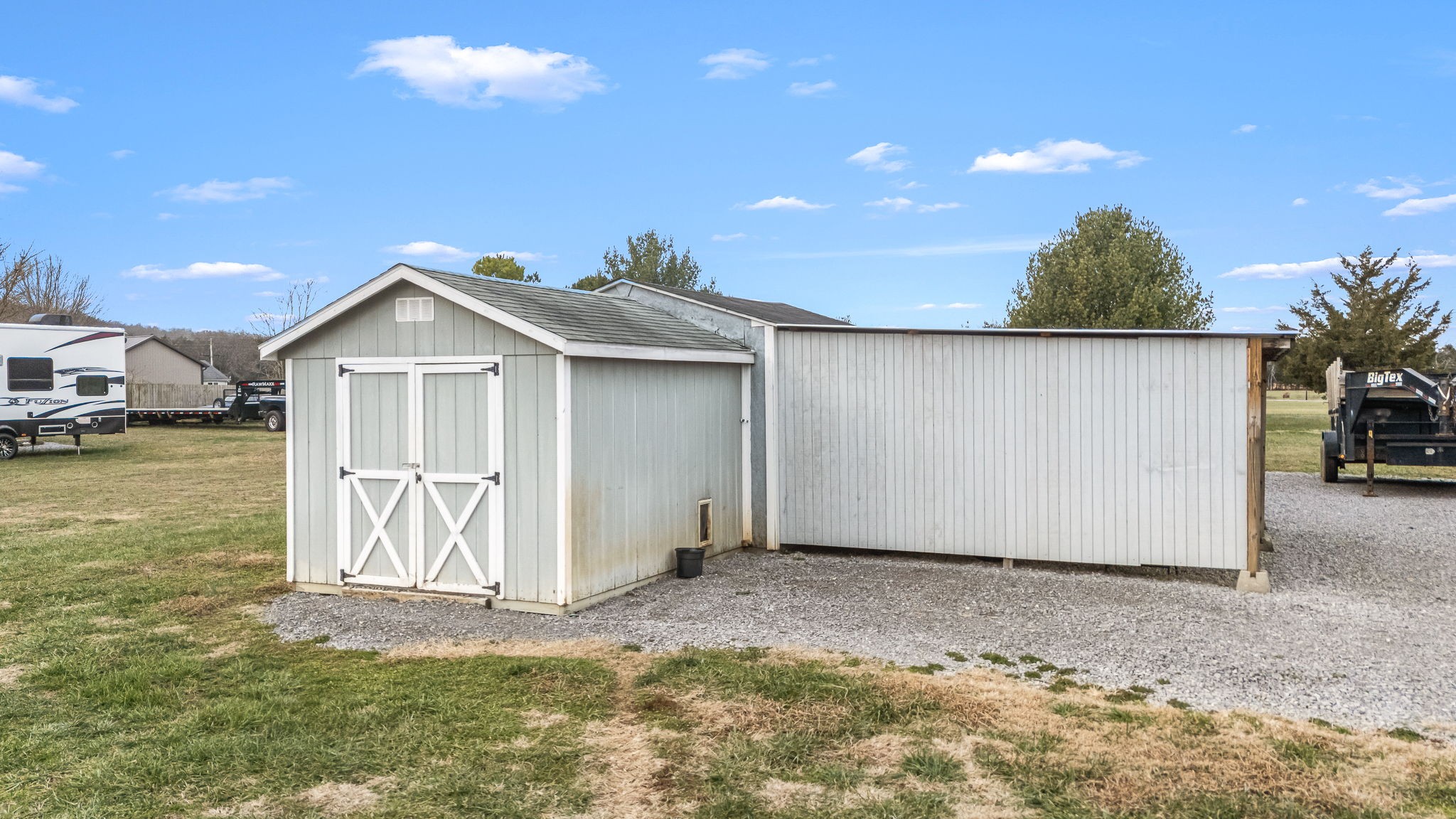 8100 Cedar Forest Road Lascassas, TN 37085 - Photo 46 of 52 a view of a house with a yard and garage
