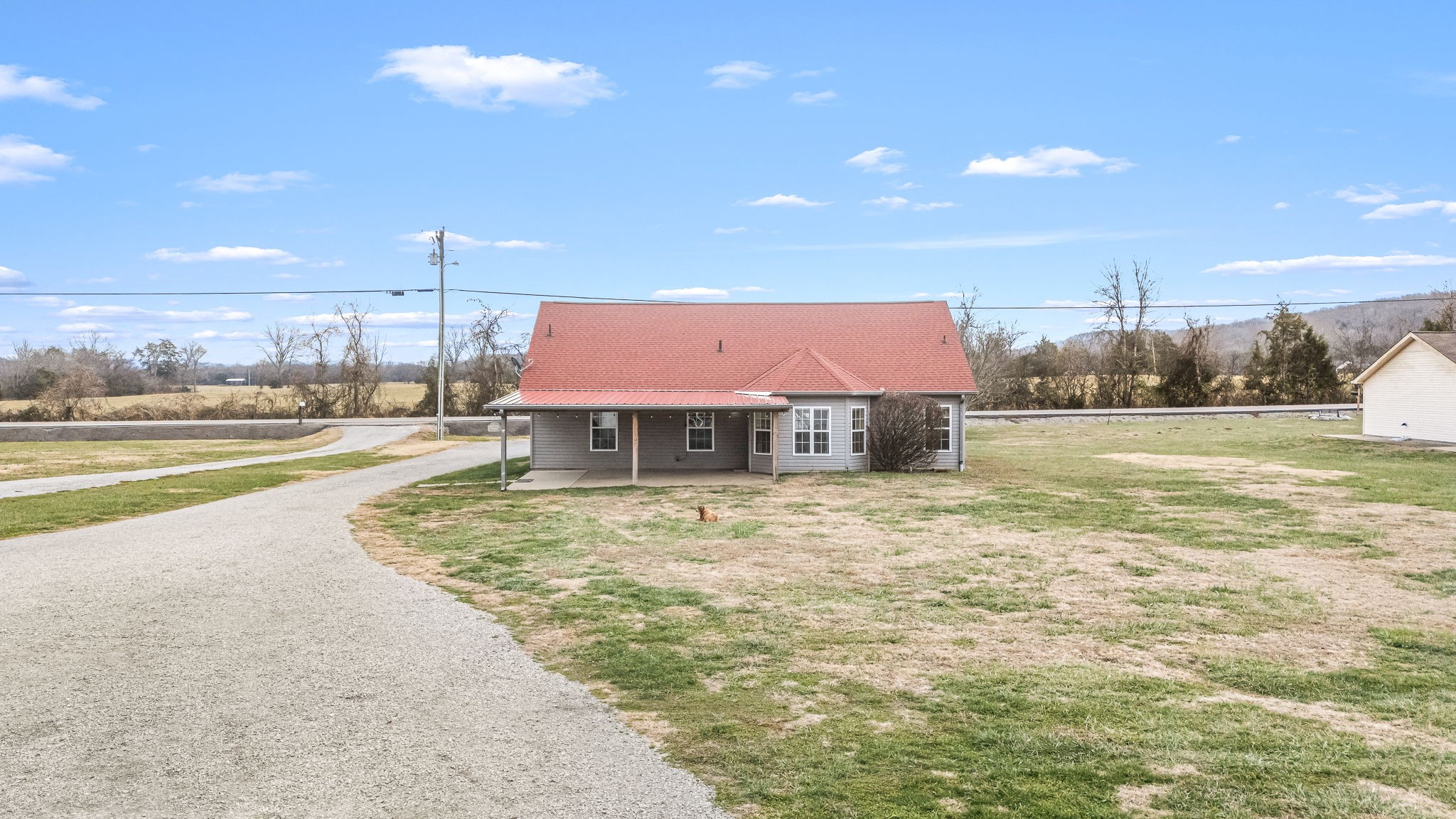8100 Cedar Forest Road Lascassas, TN 37085 - Photo 47 of 52 a view of a house with a yard and a floor to ceiling window