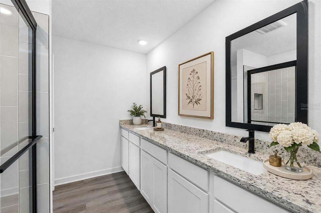 10405 Timbercrest Road Spring Hill, FL 34608 - Photo 14 of 14 a bathroom with a granite countertop sink and a mirror