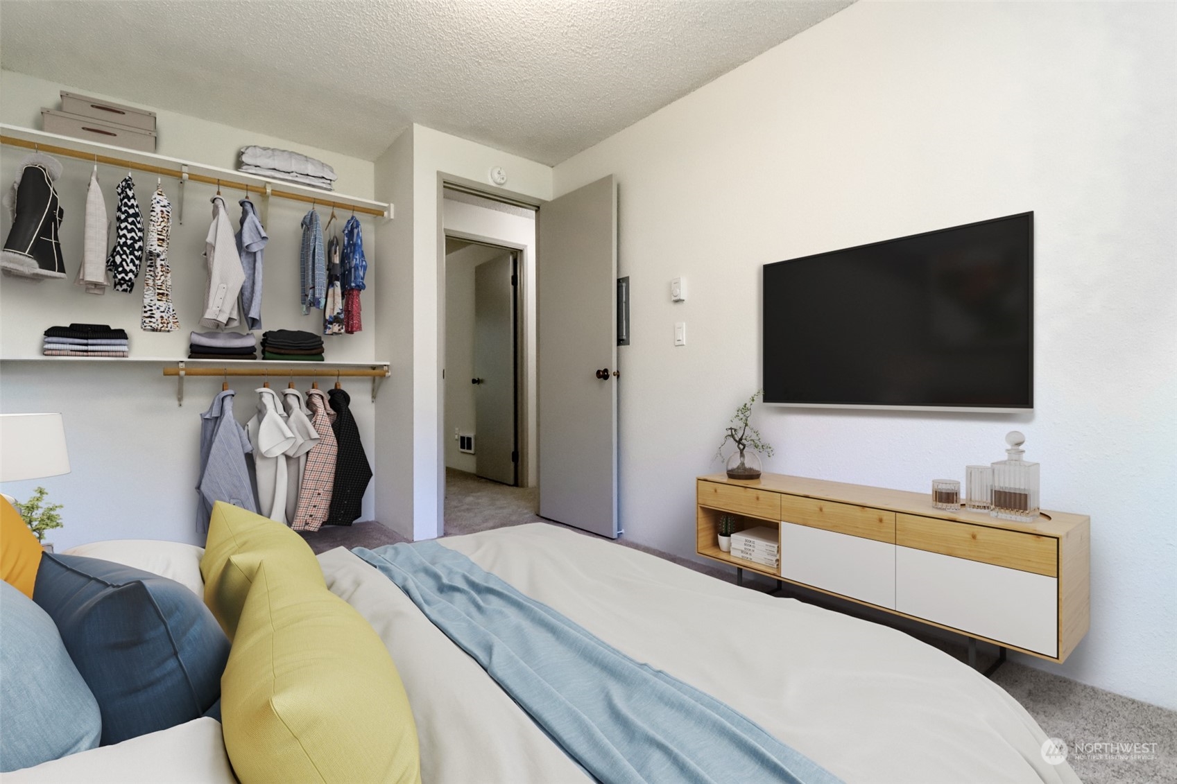 8521 South 259th Street, Unit B15 Kent, WA 98030 - Photo 16 of 26 a bedroom with a bed and flat screen tv