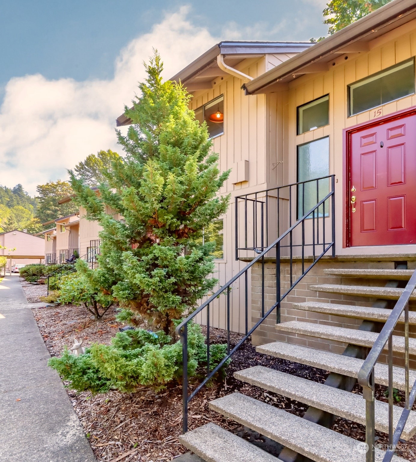 8521 South 259th Street, Unit B15 Kent, WA 98030 - Photo 2 of 26 a view of a house with a yard