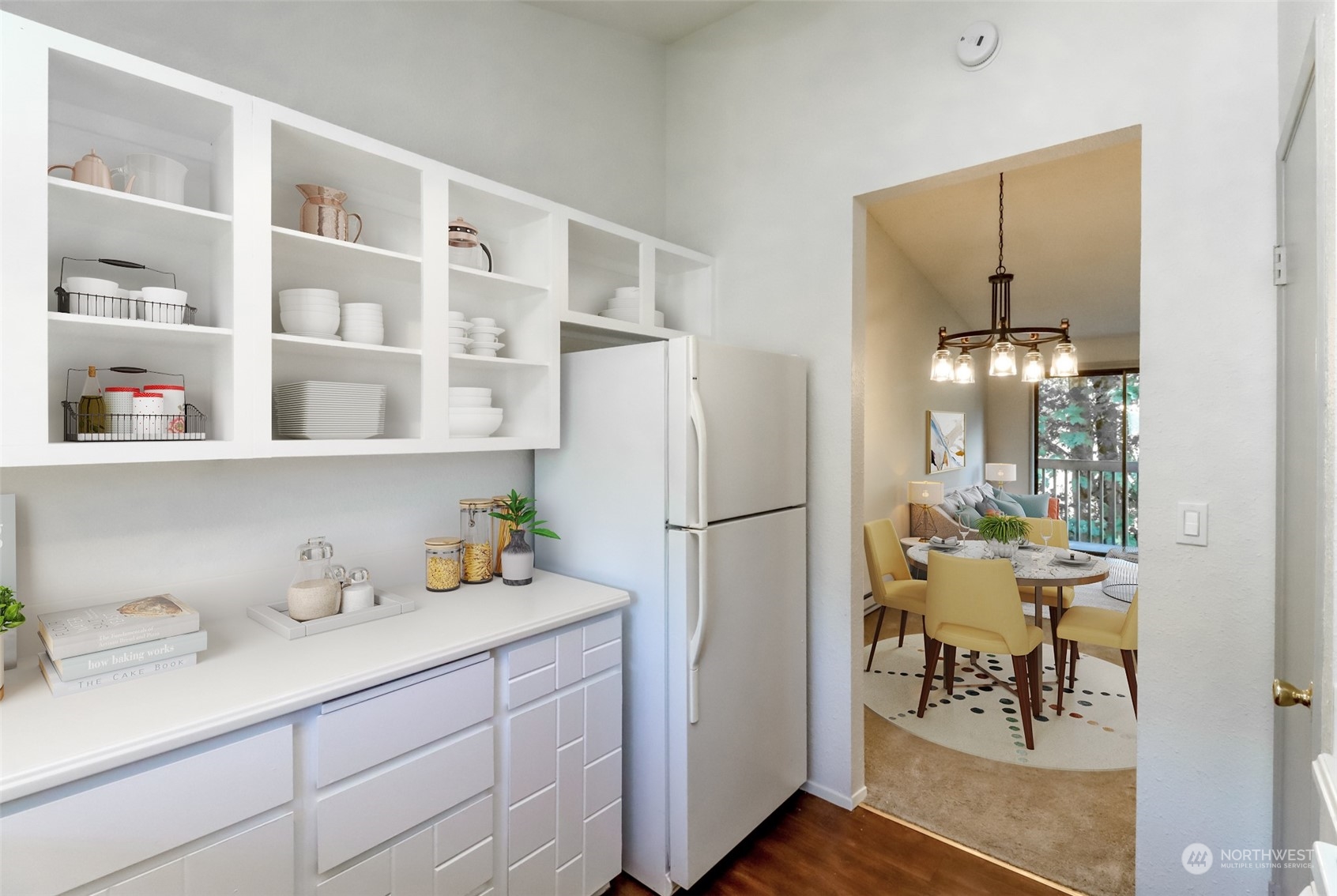 8521 South 259th Street, Unit B15 Kent, WA 98030 - Photo 8 of 26 a kitchen with a refrigerator and a table