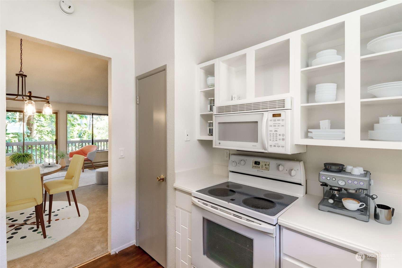 8521 South 259th Street, Unit B15 Kent, WA 98030 - Photo 9 of 26 a kitchen with stainless steel appliances white cabinets and a stove top oven