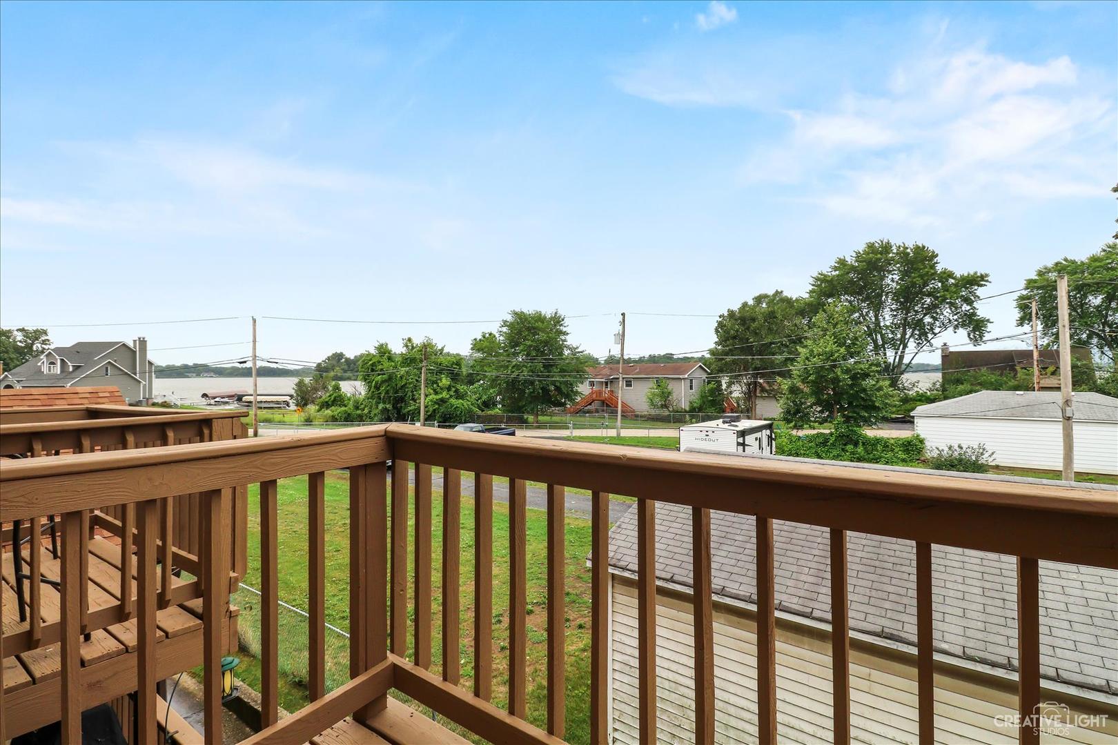 150 Eagle Point Road, Unit J Fox Lake, IL 60020 - Photo 14 of 16 a view of a balcony with city view