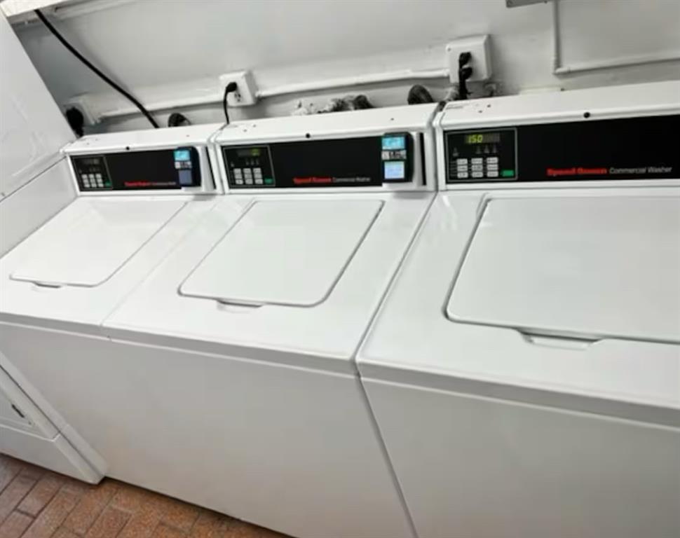 120 Northeast 20th Avenue, Unit 30 Deerfield Beach, FL 33441 - Photo 12 of 14 a view of a kitchen with stainless steel appliances wooden floor and a counter top space
