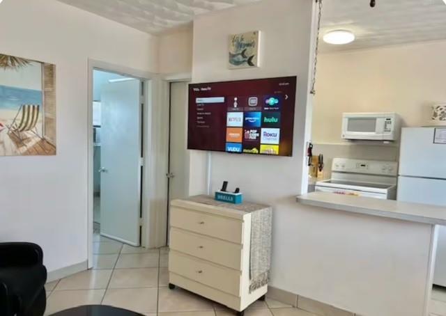 120 Northeast 20th Avenue, Unit 30 Deerfield Beach, FL 33441 - Photo 3 of 14 a bathroom with a sink a mirror and a shower