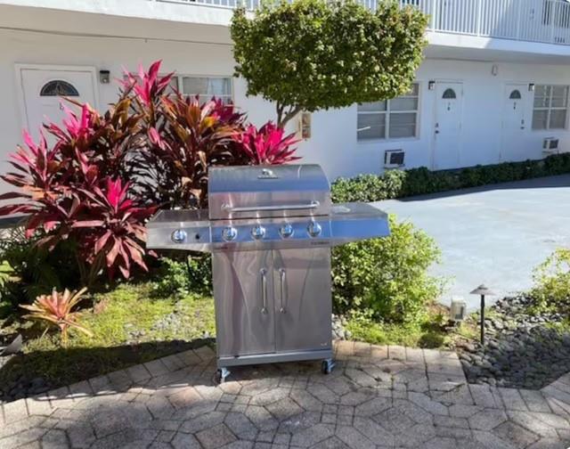 120 Northeast 20th Avenue, Unit 30 Deerfield Beach, FL 33441 - Photo 10 of 14 a front view of a house with a lot of flowers and trees
