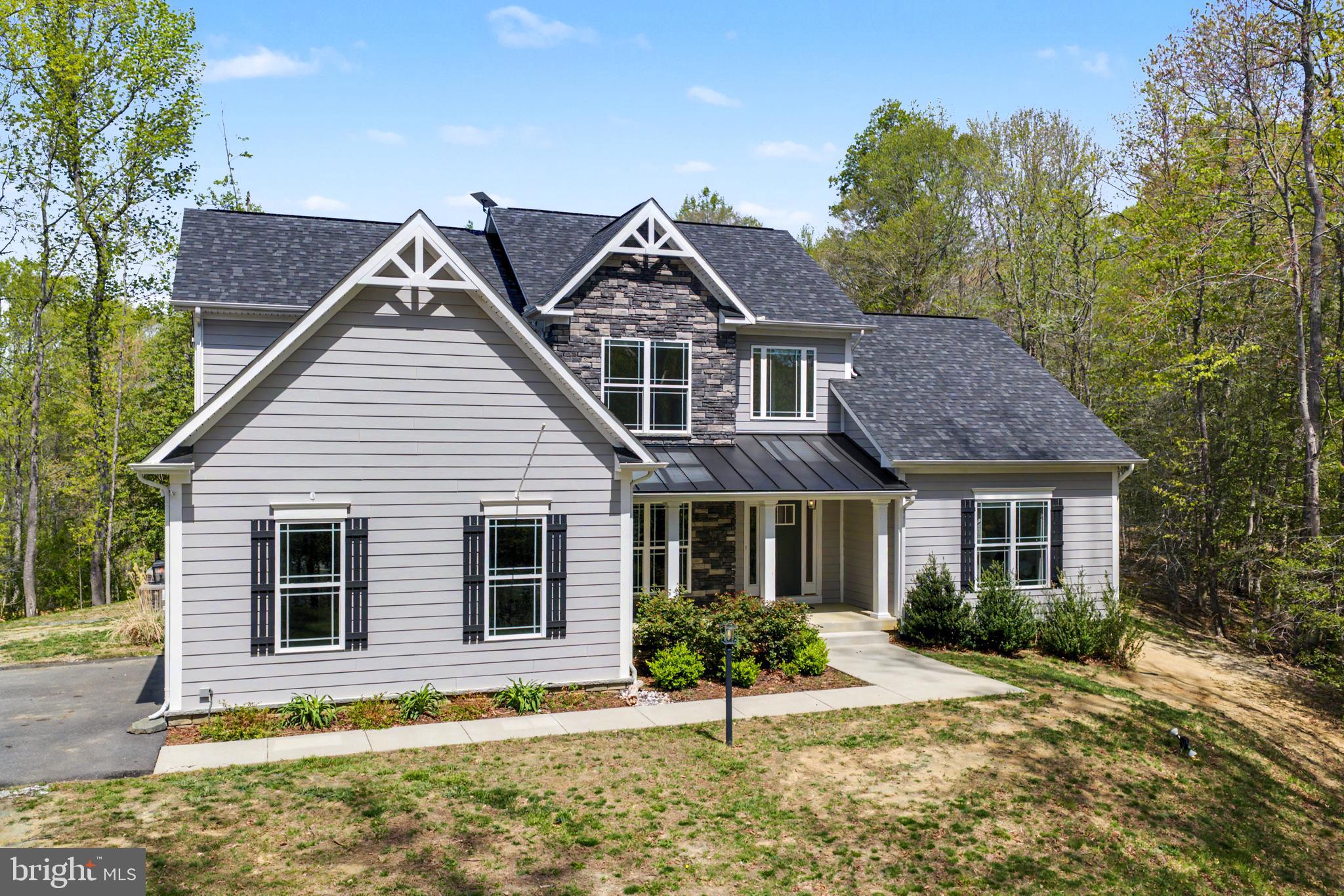 7195 Compass Court King George, VA 22485 - Photo 1 of 58 front view of a house with a yard
