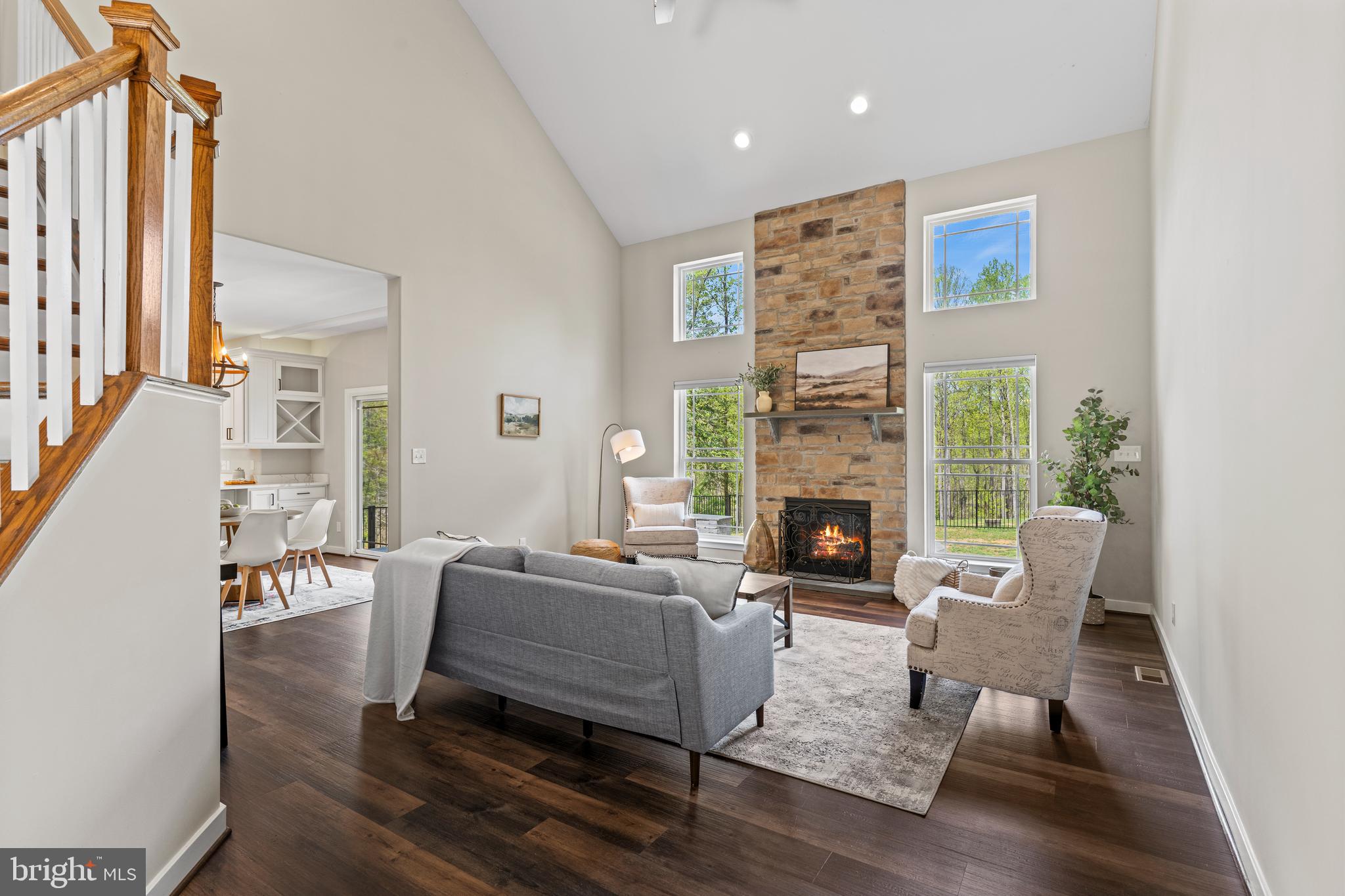 7195 Compass Court King George, VA 22485 - Photo 15 of 58 a living room with furniture wooden floor and a fireplace