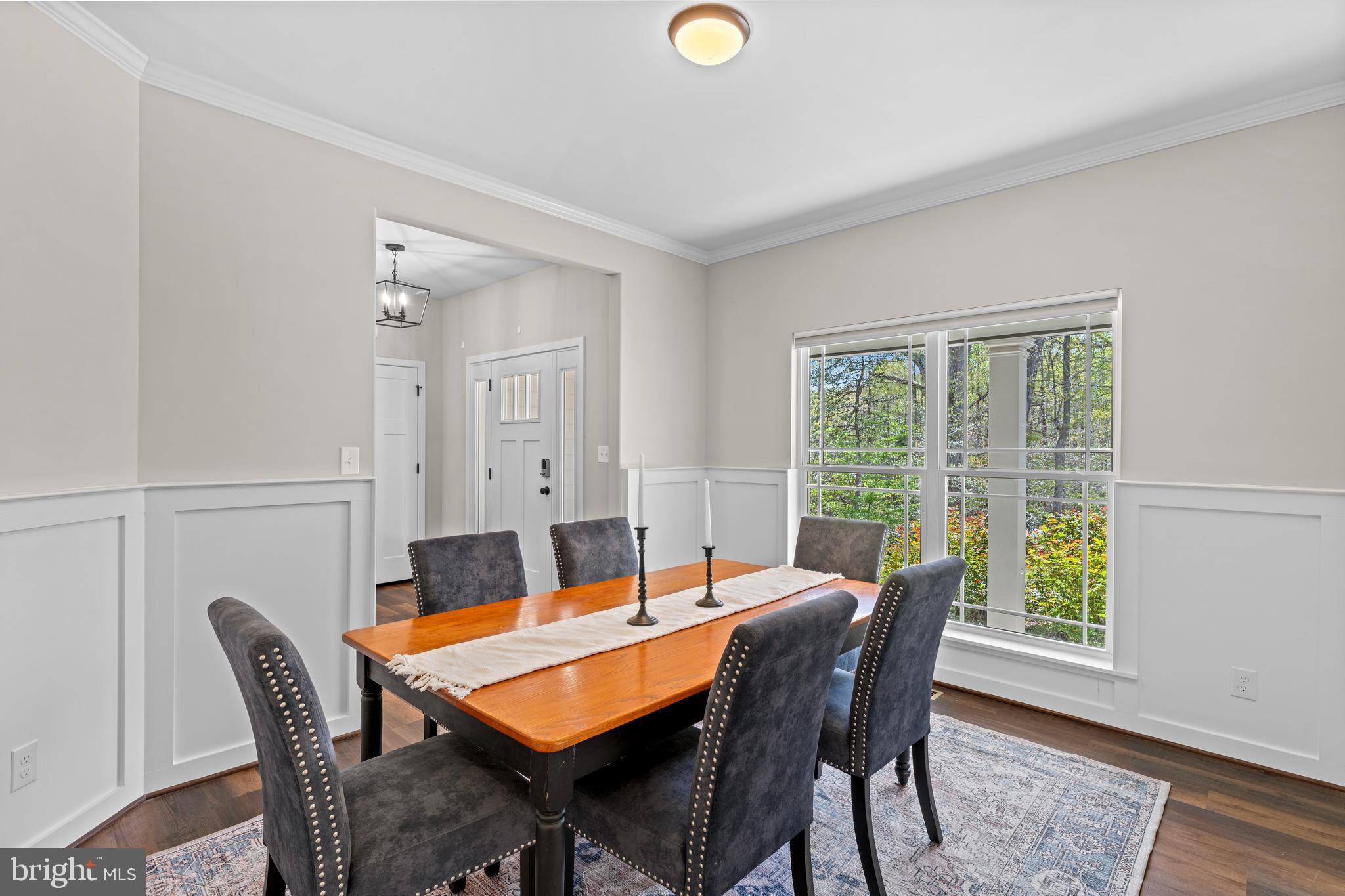 7195 Compass Court King George, VA 22485 - Photo 16 of 58 a view of a dining room with furniture and wooden floor