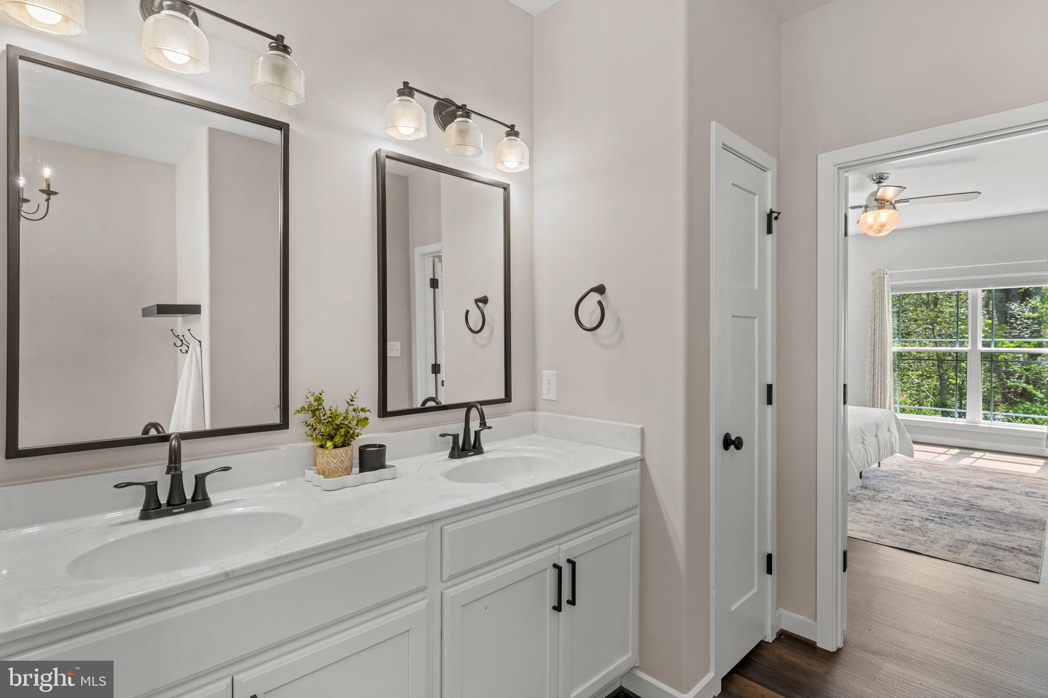 7195 Compass Court King George, VA 22485 - Photo 21 of 58 a bathroom with double vanity sinks and a mirror