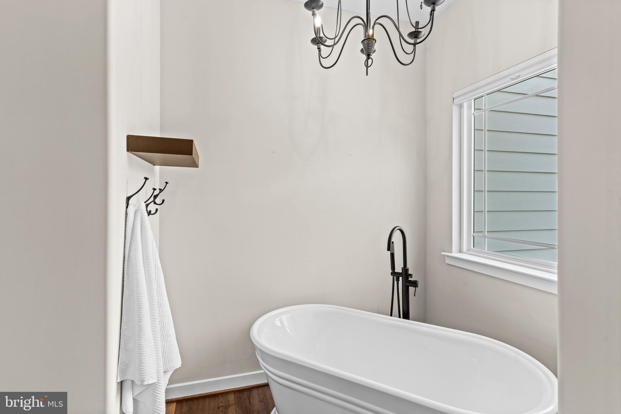 7195 Compass Court King George, VA 22485 - Photo 22 of 58 a bathroom with a sink a mirror and a toilet
