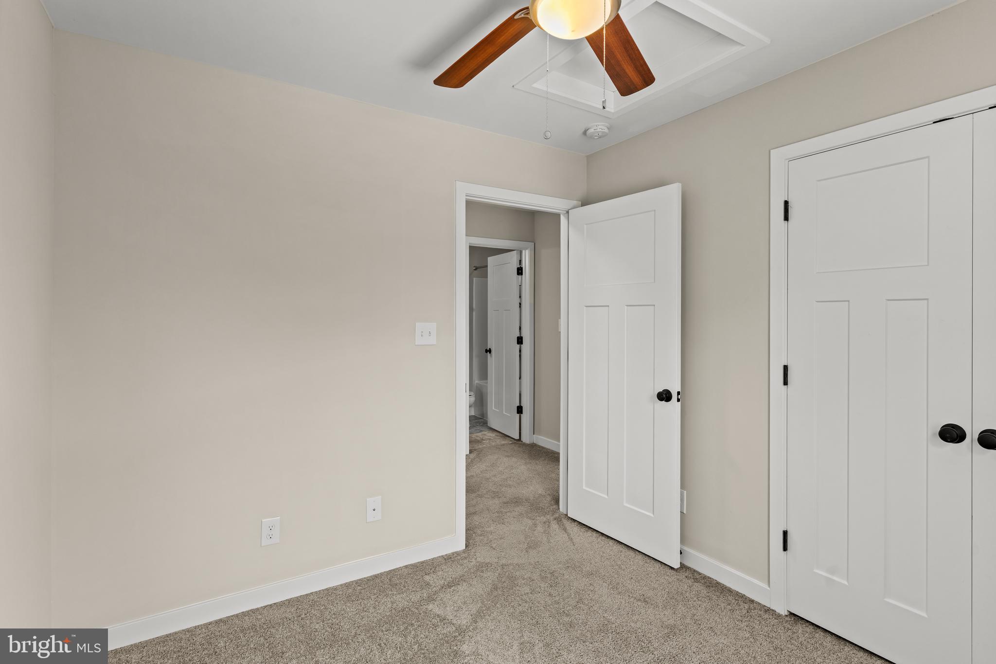 7195 Compass Court King George, VA 22485 - Photo 27 of 58 an empty room with chandelier fan and windows