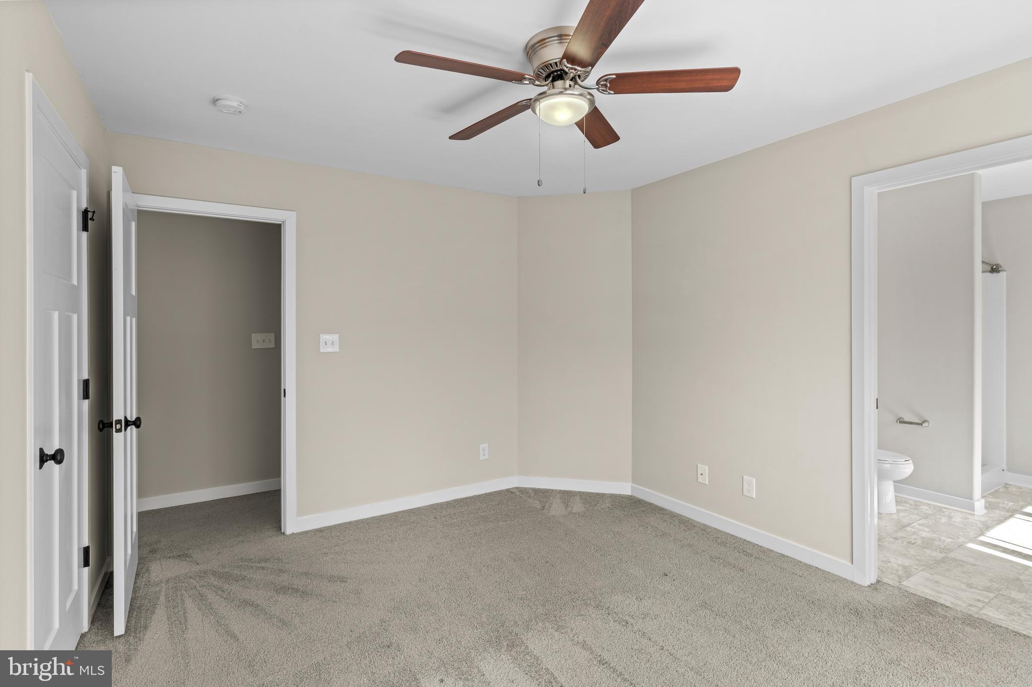 7195 Compass Court King George, VA 22485 - Photo 29 of 58 an empty room with closet and a ceiling fan