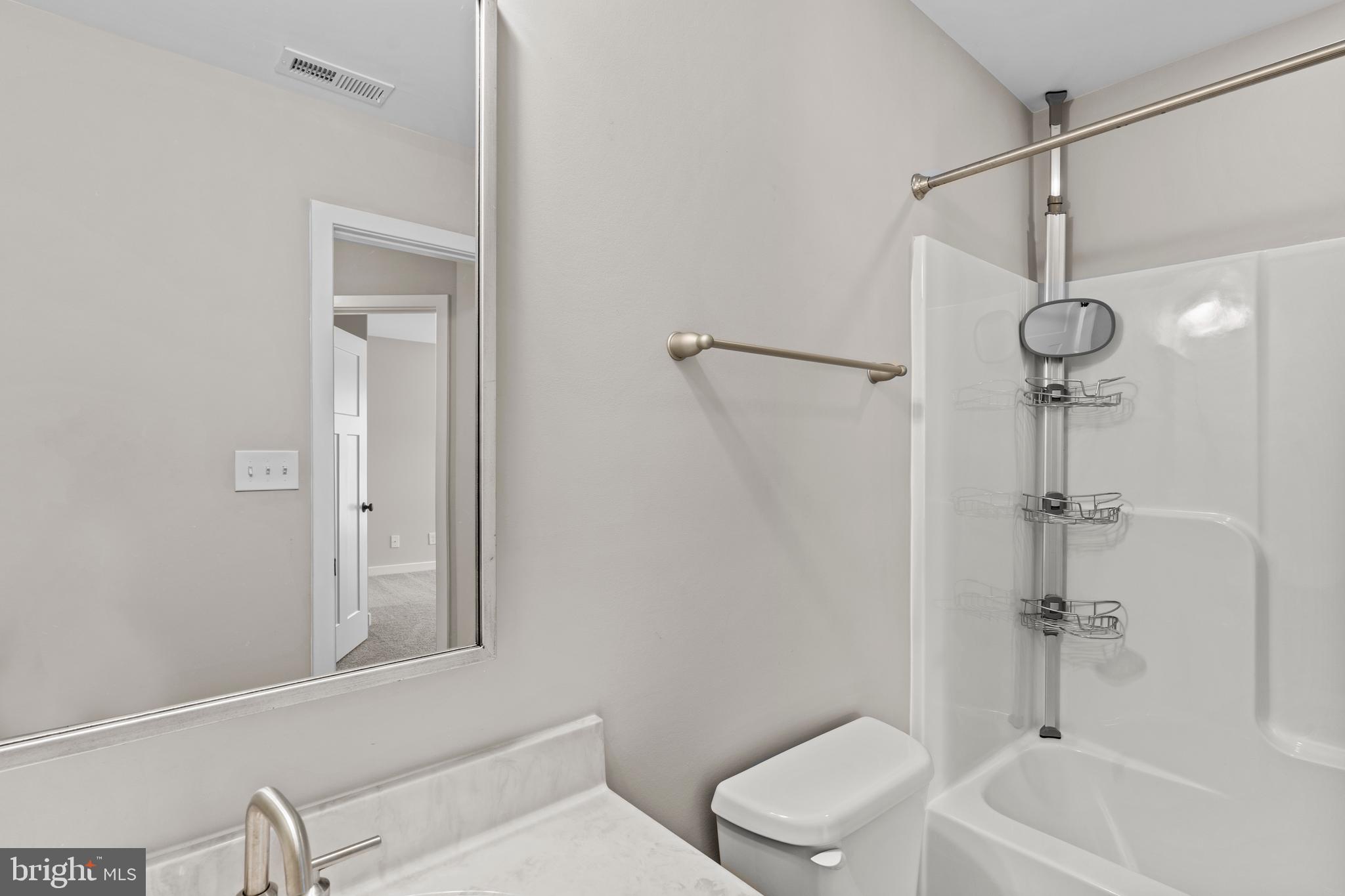 7195 Compass Court King George, VA 22485 - Photo 32 of 58 a bathroom with a toilet a sink and bathtub