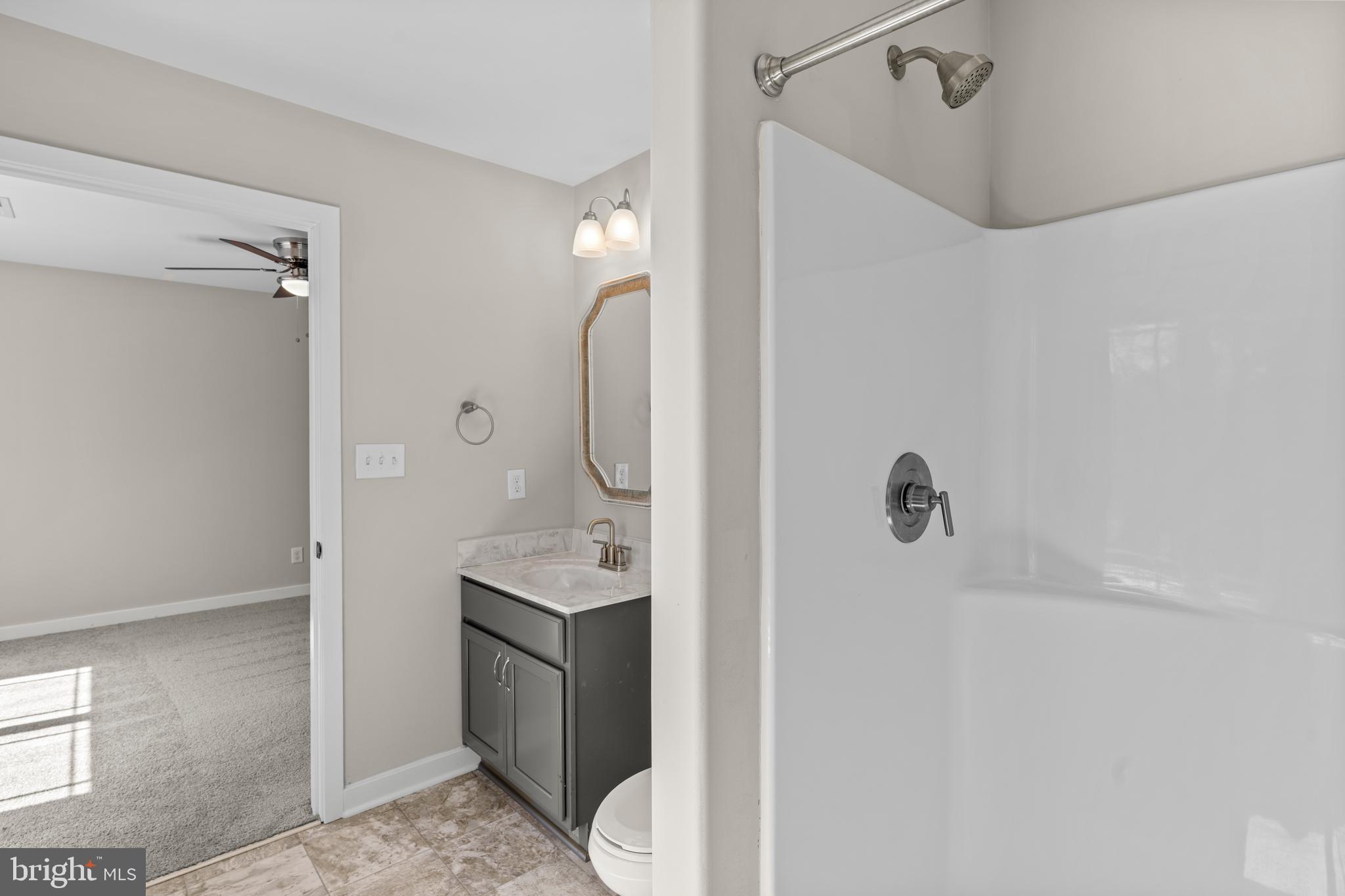 7195 Compass Court King George, VA 22485 - Photo 33 of 58 a bathroom with a sink a toilet and shower