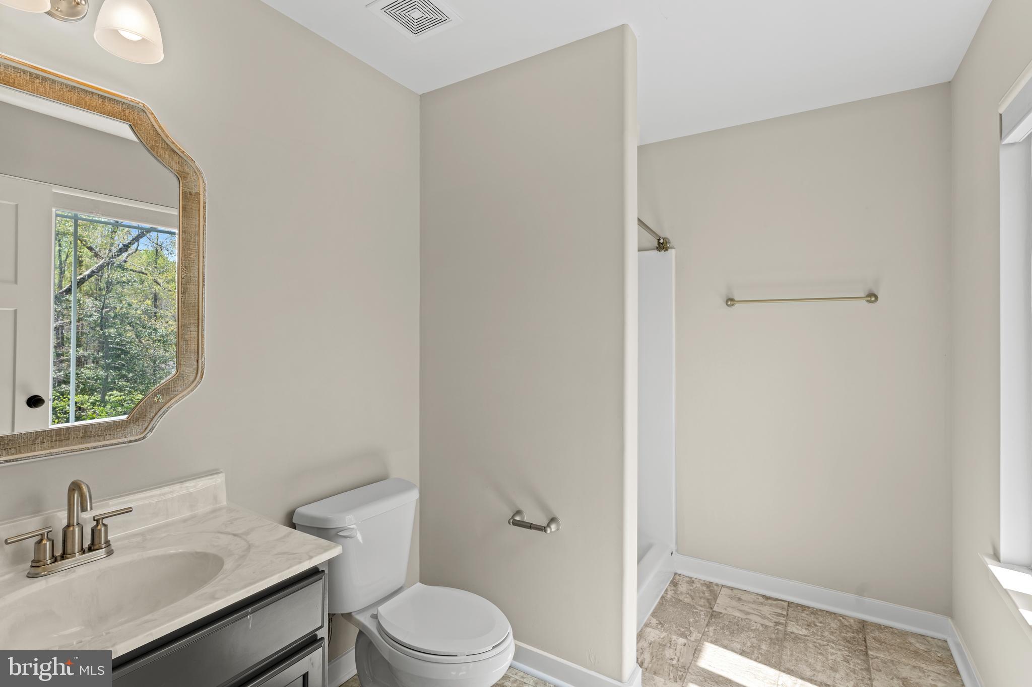 7195 Compass Court King George, VA 22485 - Photo 34 of 58 a bathroom with a sink toilet vanity and shower