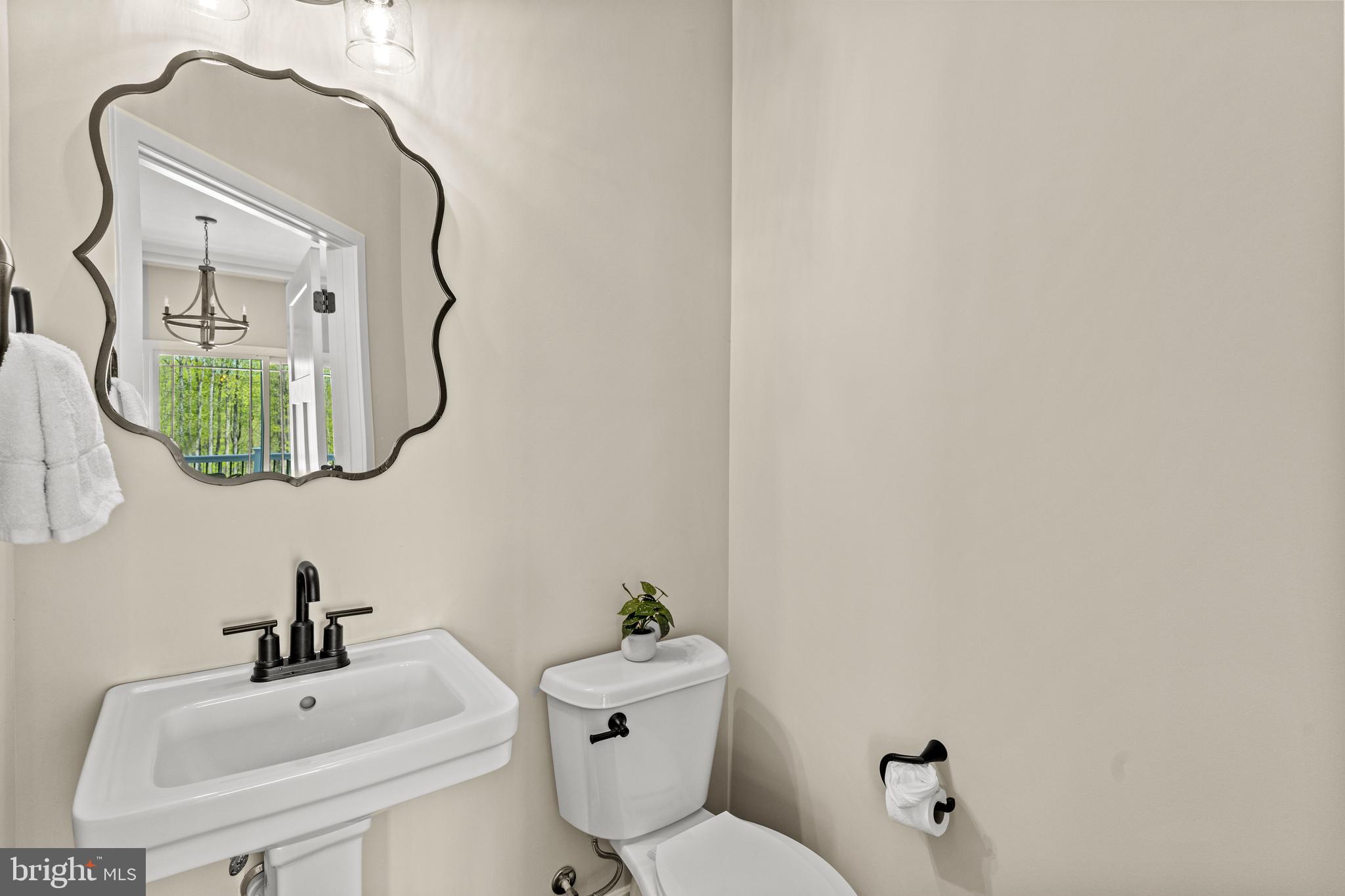 7195 Compass Court King George, VA 22485 - Photo 35 of 58 a bathroom with a sink mirror and toilet