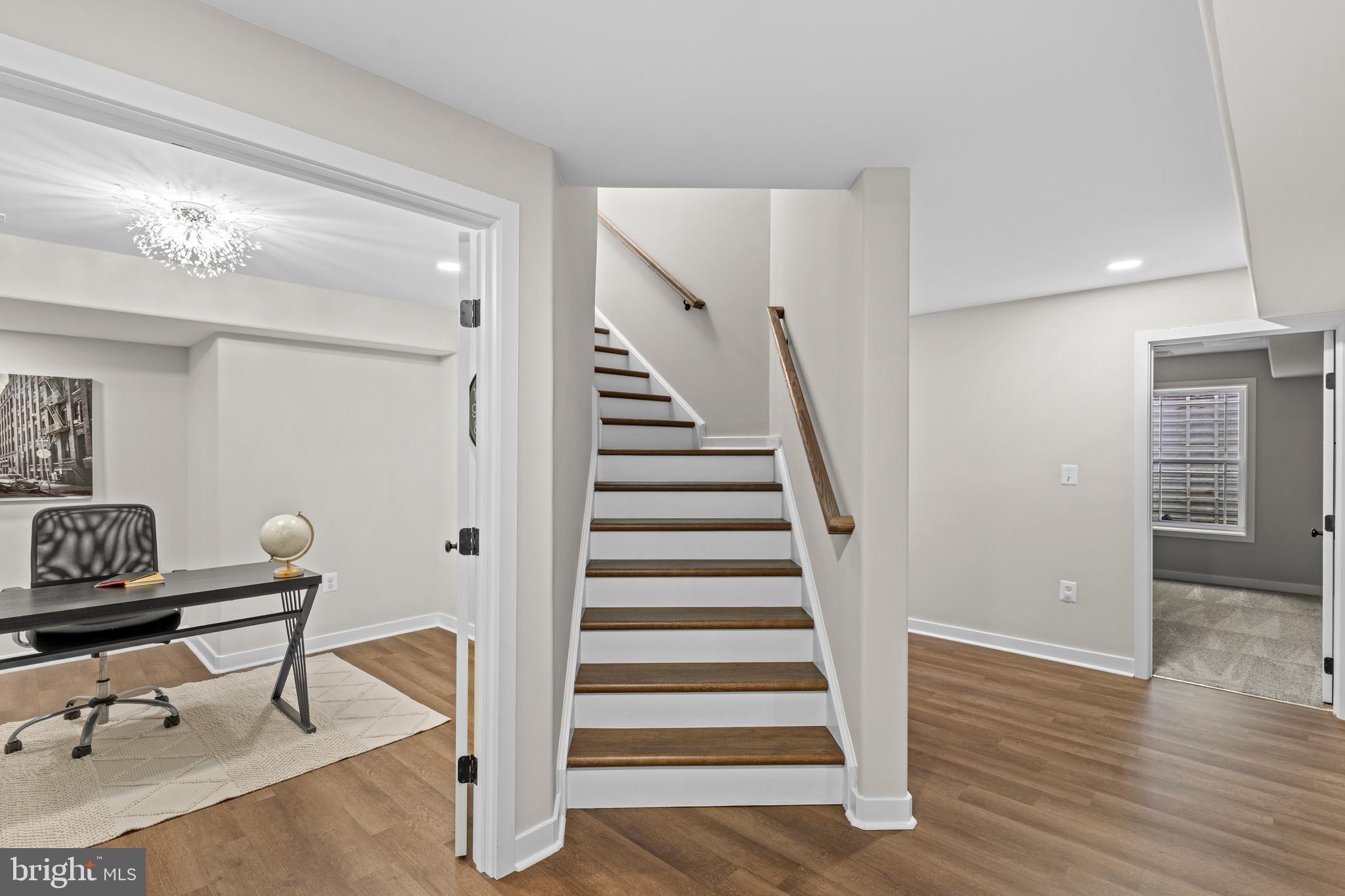 7195 Compass Court King George, VA 22485 - Photo 36 of 58 a view of entryway with stairs and wooden floor
