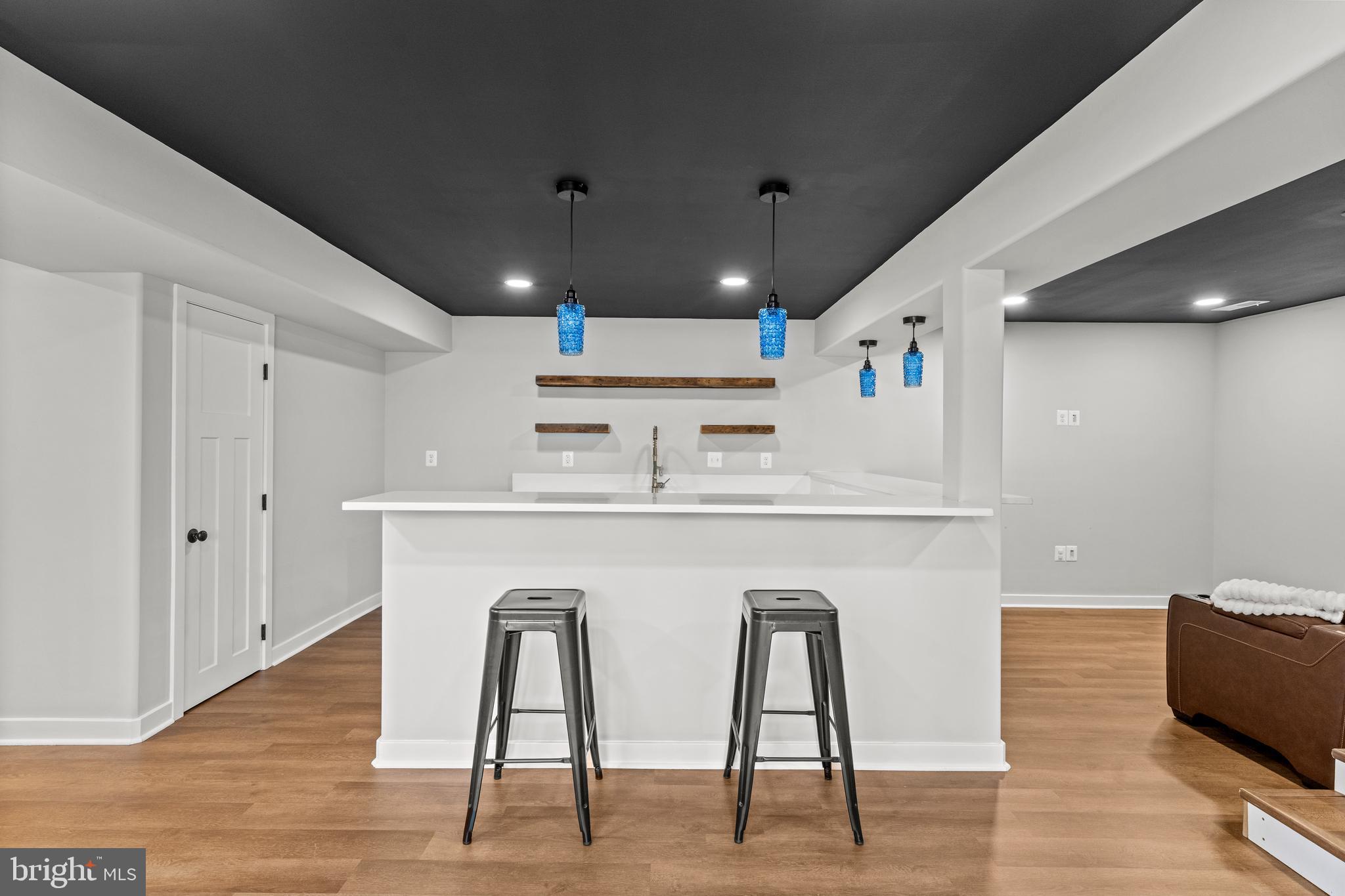 7195 Compass Court King George, VA 22485 - Photo 38 of 58 a kitchen with furniture and wooden floor