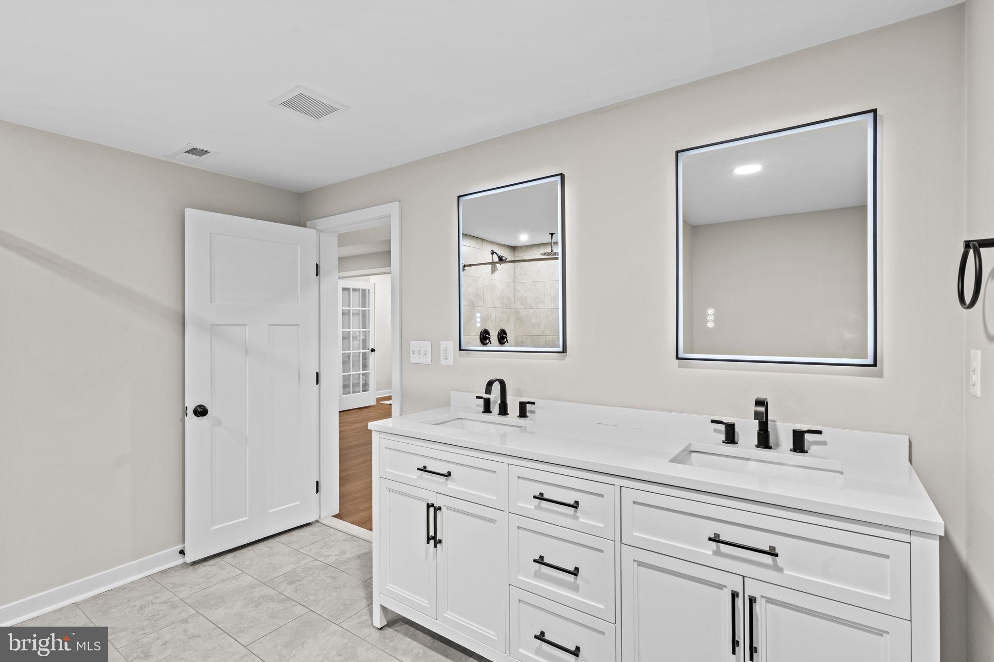 7195 Compass Court King George, VA 22485 - Photo 45 of 58 a bathroom with double vanity sink and mirror