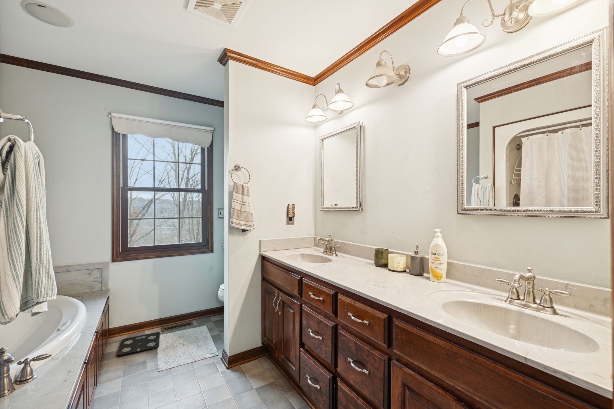 516 Rhotons Chapel Road Manchester, TN 37355 - Photo 26 of 55 a spacious bathroom with a double vanity sink double mirror and bathtub