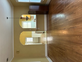 413 Fowzer Street Taylor, TX 76574 - Photo 9 of 9 a view of empty room with wooden floor