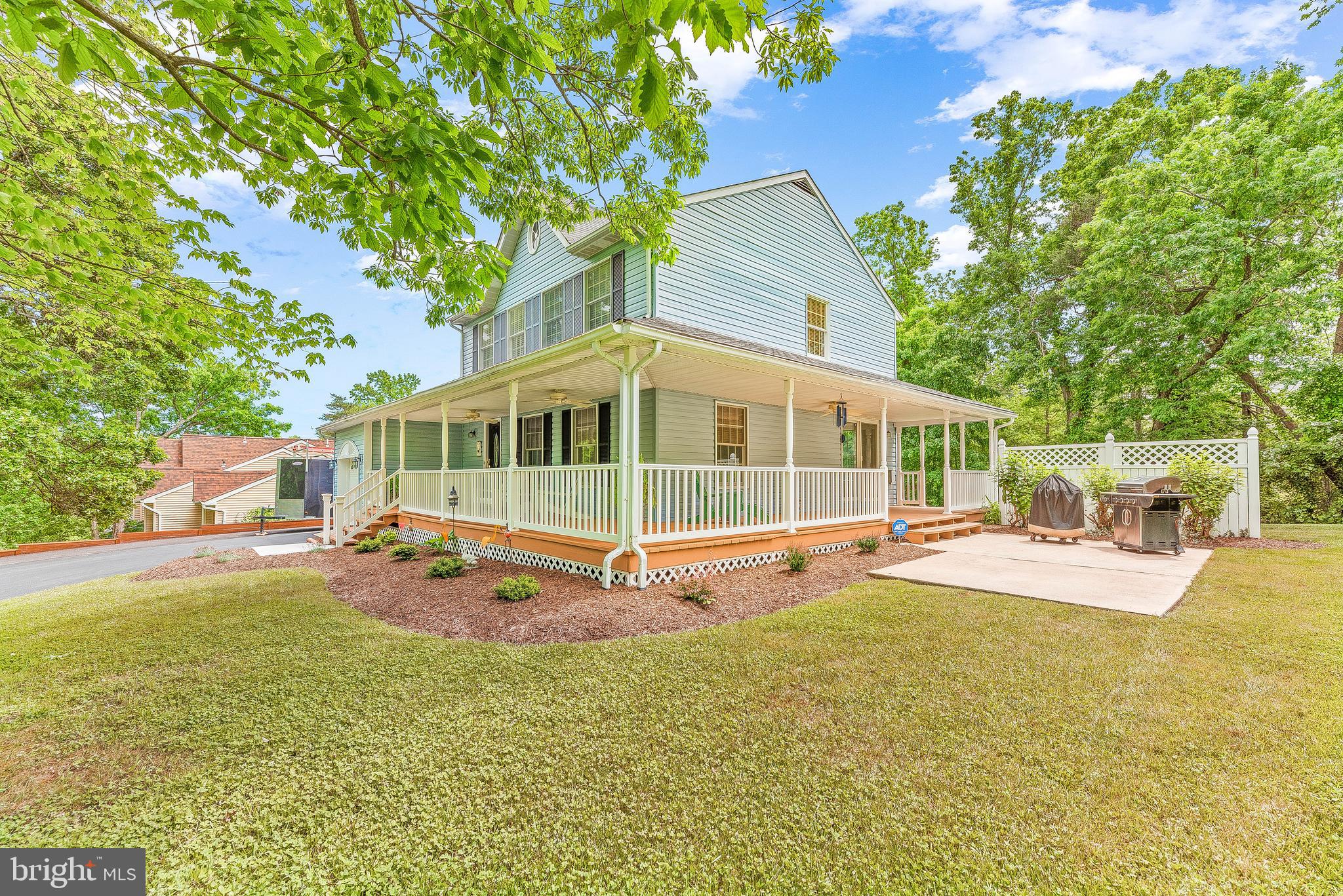 2717 Cove Point Road Lusby, MD 20657 - Photo 5 of 38 Wrap Around Porch w/ well maintained landscaping