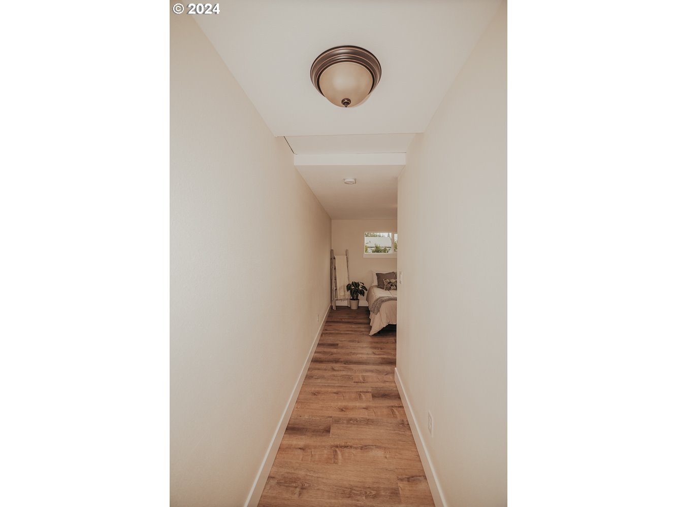 901 25th Street Springfield, OR 97477 - Photo 13 of 27 a hallway with a view of a bathroom