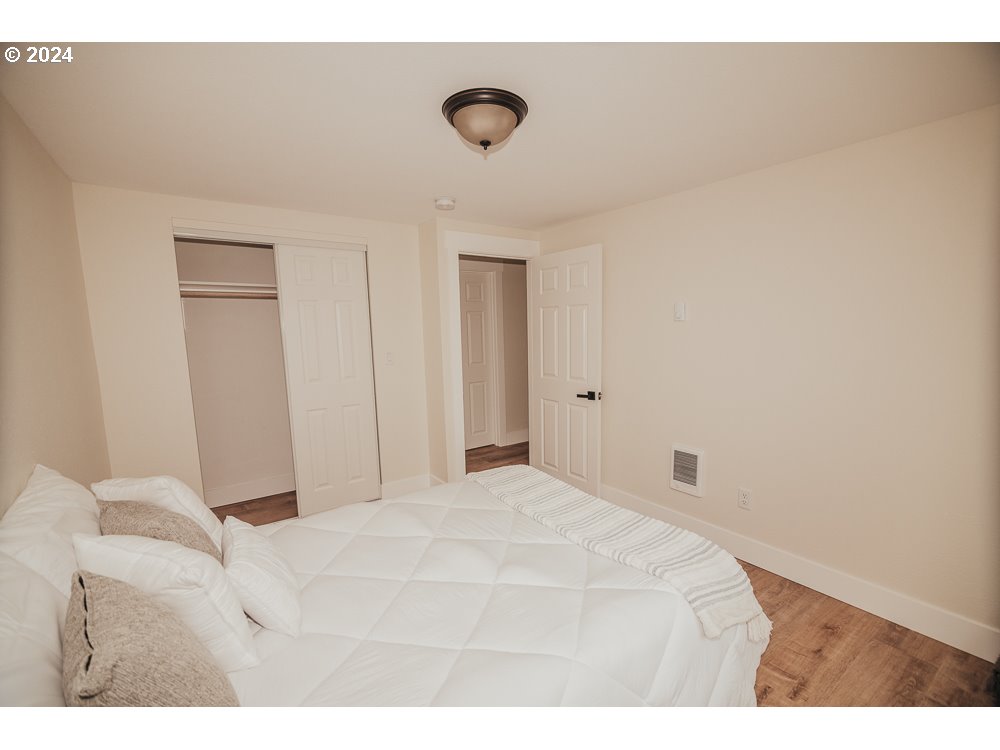 901 25th Street Springfield, OR 97477 - Photo 17 of 27 a bedroom with a bed and a walk in closet