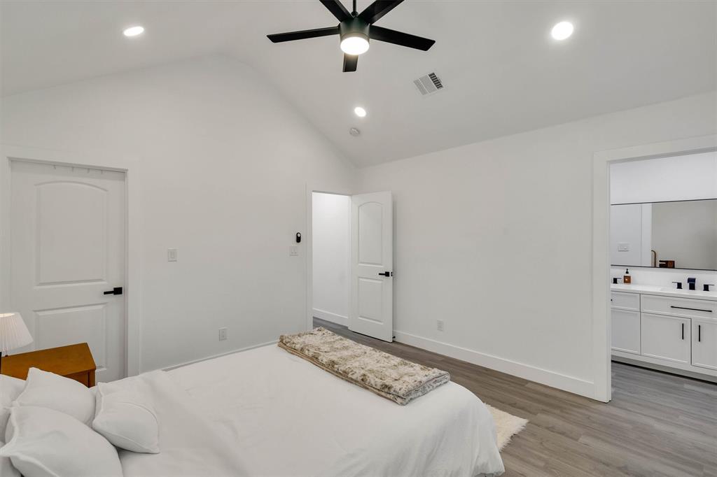 801 Southeast 4th Street Cooper, TX 75432 - Photo 23 of 37 a bedroom with a bed and a ceiling fan