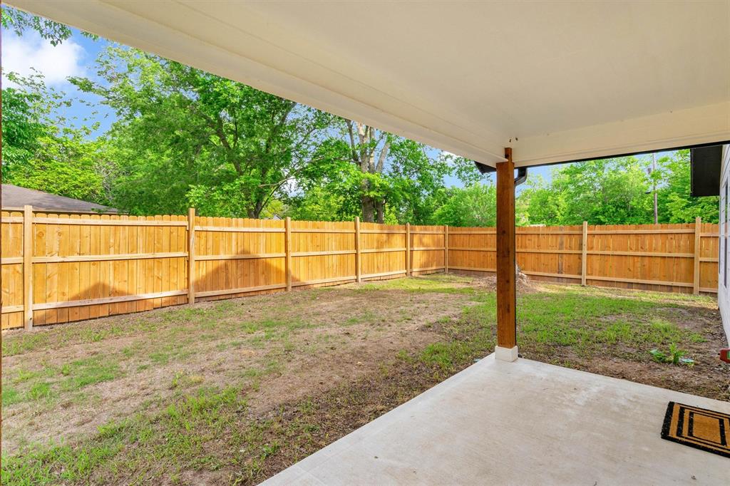 801 Southeast 4th Street Cooper, TX 75432 - Photo 30 of 37 a view of a backyard with floor to ceiling windows