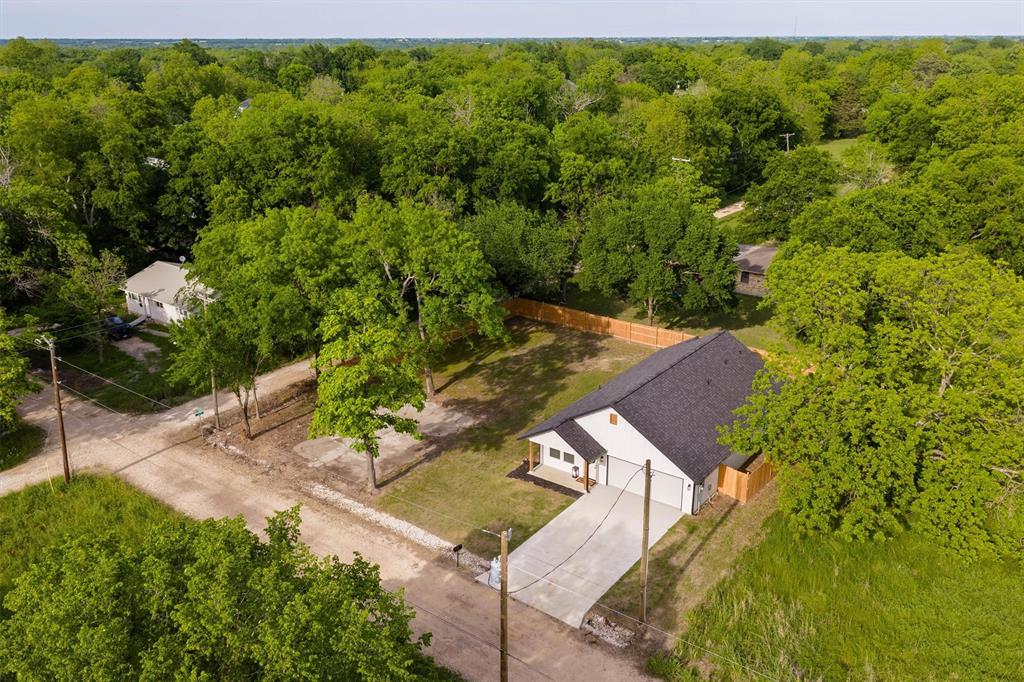 801 Southeast 4th Street Cooper, TX 75432 - Photo 36 of 37 a view of a yard with an outdoor space