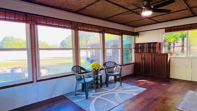 a view of dinning room with furniture window and outside view